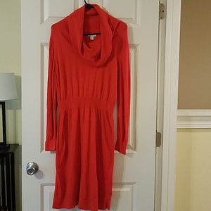 Orange cowl neck sweater dress.
